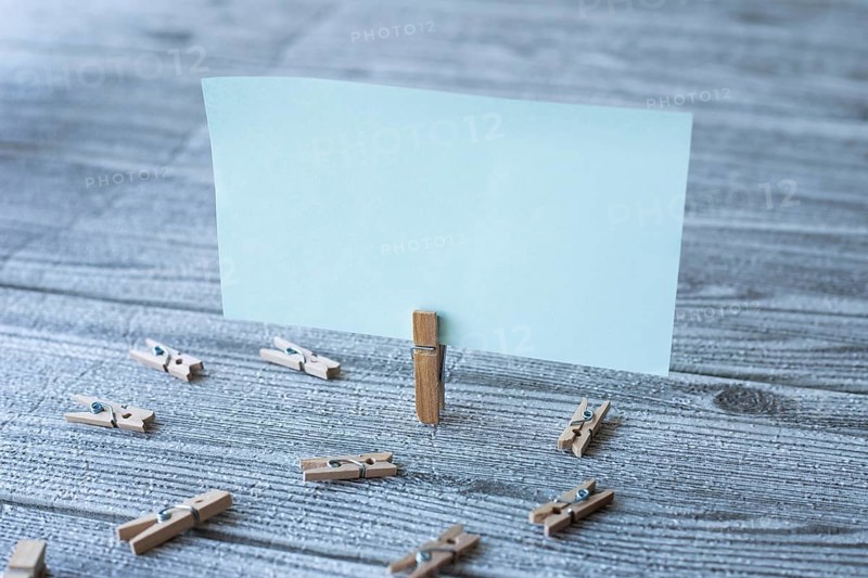 Piece Of Blank Square Note Surrounded By Laundry Clips Showing New Idea