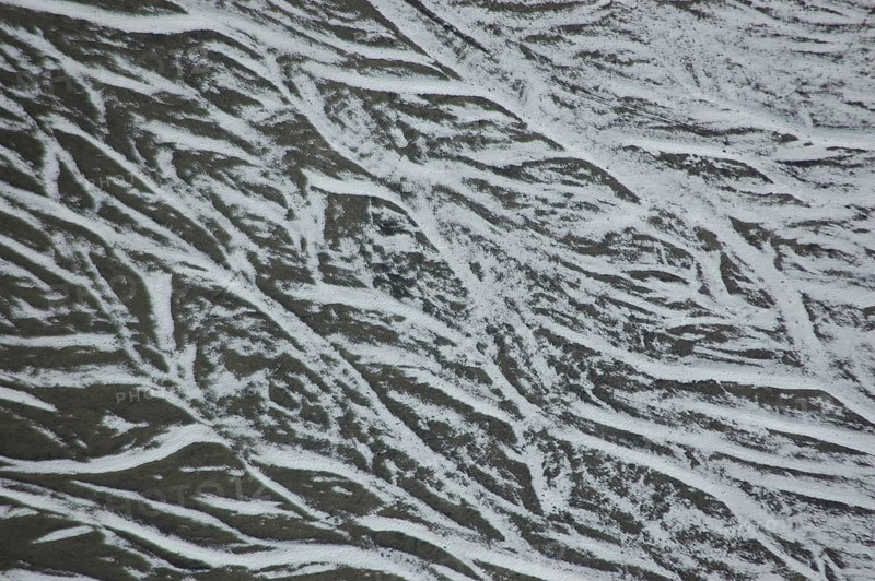 Pattern of snow in braided river bed near Lake Coleridge, Canterbury, New Zealand, Oceania