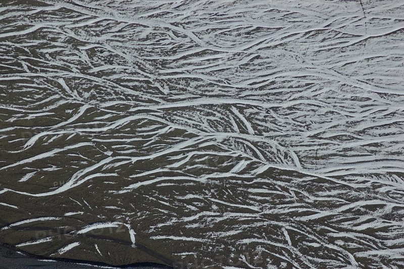 Pattern of snow in braided river bed near Lake Coleridge, Canterbury, New Zealand, Oceania