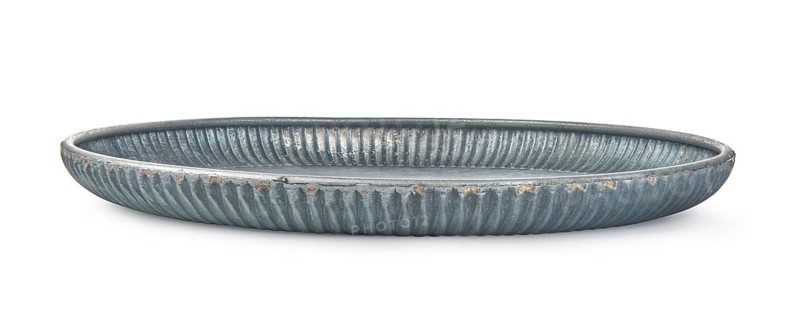 Figured metal dish isolated on white, horizontal view