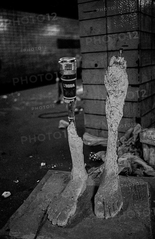 GDR, Berlin, 17 June 1990, Oranienburger Straße S-Bahn station, figures set up by the Weißensee art academy in the closed S-Bahn station, which were destroyed by someone at the beginning of construction work at the station..., vodka bottle