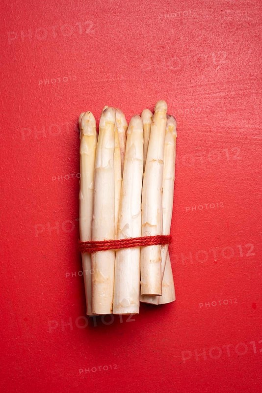 Bunch of white asparagus tied with a string. Above view with a bundle of white german white asparagus