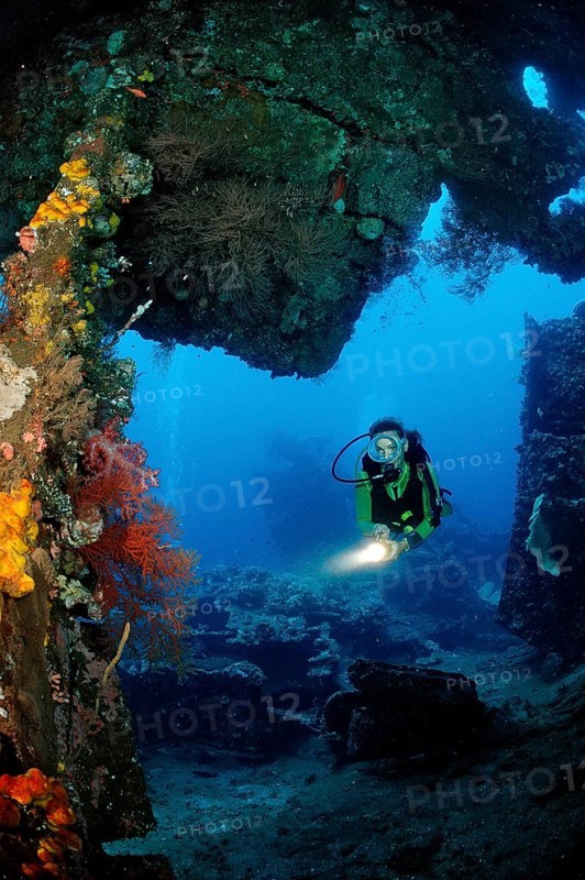 Two divers examine the Liberty shipwreck, Bali, Tulamben, Indian Ocean, Indonesia, Asia