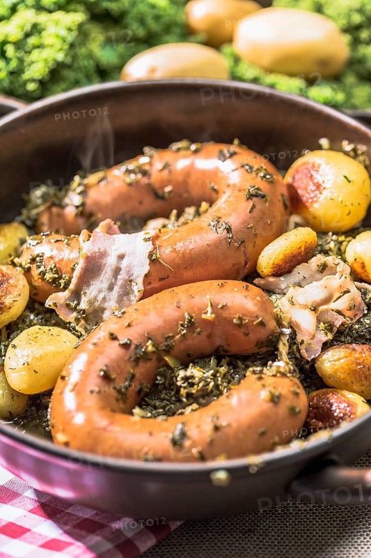 Kale with Bregenwurst sausage and roast potatoes