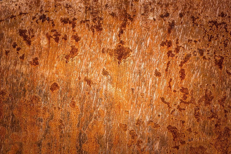 Old rusty metal plate surface very aged and corroded. Image great as background, layer or a rusty frame