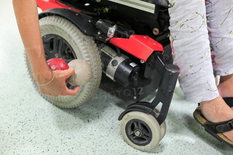 Disabled Boccia player training on a wheelchair