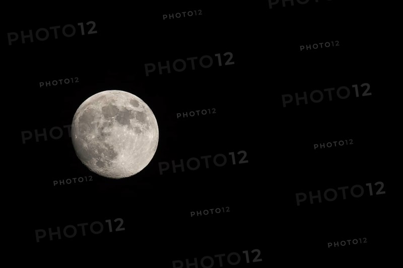 Waxing gibbous Moon, landscape orientated image with Moon isolated on black background with text or copy space