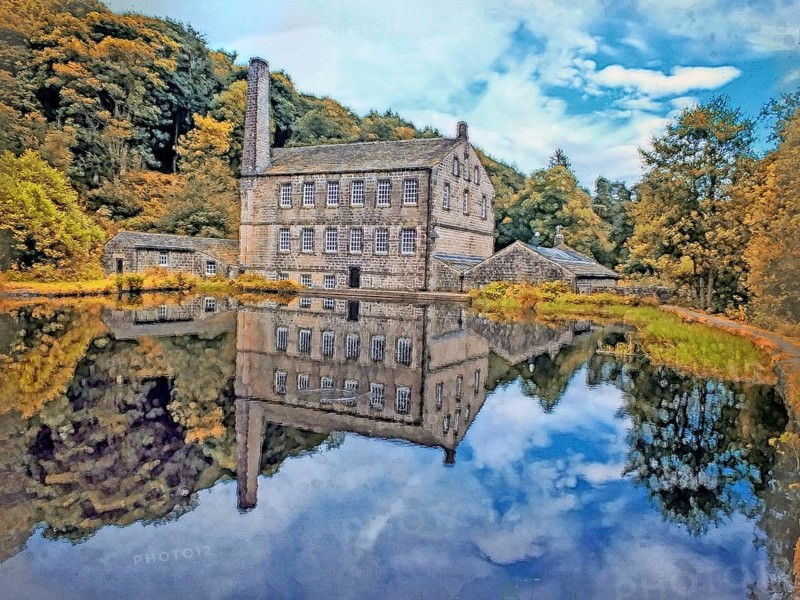 Watercolor painting of gibson mill a water powered mill with main bulding relected in the pond in hardcastle crags near hebden bridge in west yorkshire