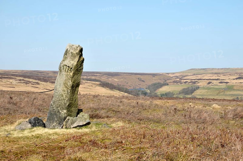 The greenwood stone a historic 16th century boundary marking the borders of midgley and wadworth moor in calderdale west yorkshire surrounded by pennine landscape