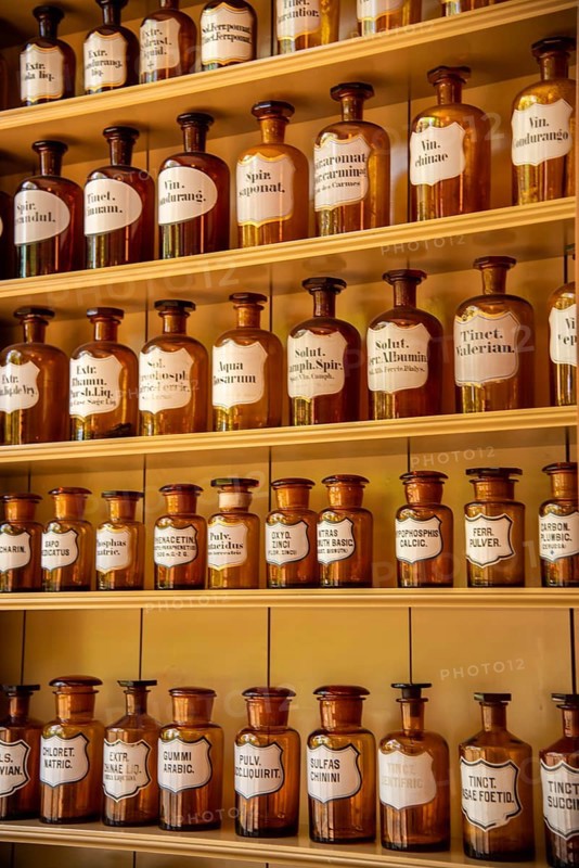 Enkhuizen, Netherlands, June 2022. Shelves with glass jars containing ingredients for medicine. Close up. Selective focus