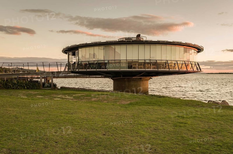 Porto Alegre, Rio Grande do Sul, Brazil, March 29, 2021: Panoramic restaurant on the Guaíba waterfront in silhouette at sunset, South America