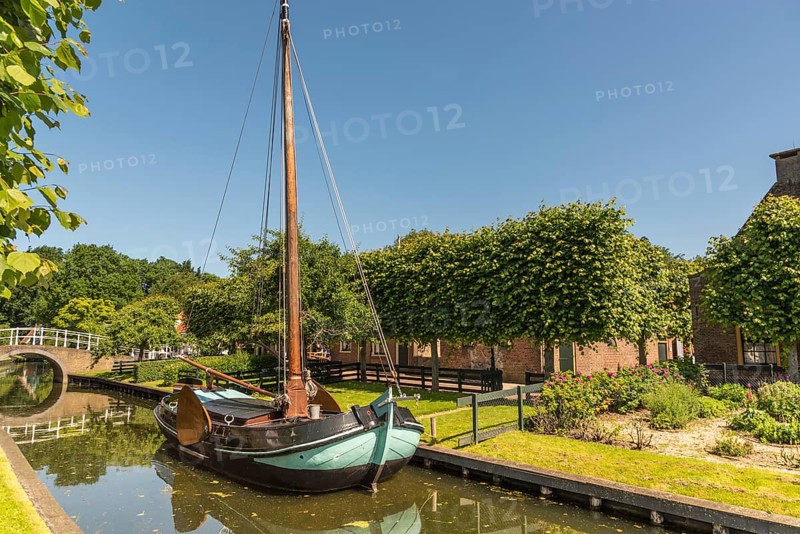 Enkhuizen, the Netherlands. June, The Zuiderzeemuseum, an open air museum at the shore of the IJsselmeer with traditional Dutch fishermen cottages and flat bottomed fishing boats