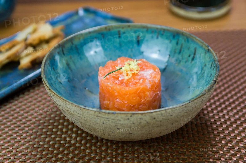 Salmon tartare deliciousness in a beautiful decorated plate