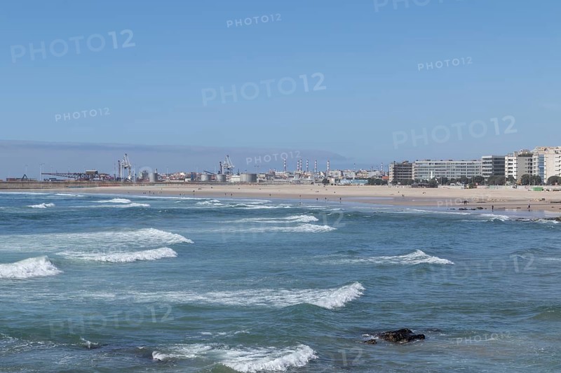 Town view with sandy beach and surf in the Atlantic Ocean at Praia de Matosinhos beach in Matosinhos, Norte region, Porto district, Portugal, Europe