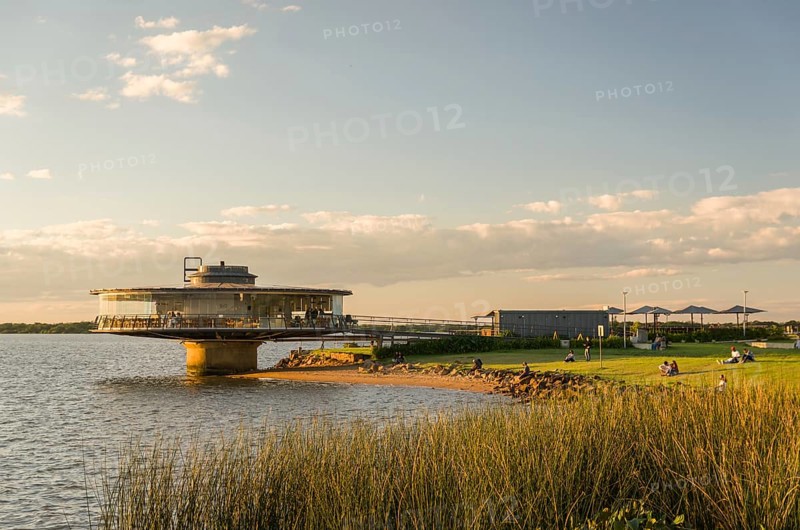 Porto Alegre, Rio Grande do Sul, Brazil, March 29, 2021: Beautiful sunset on the waterfront of Guaíba, Gasometro panorama restaurant at golden hour, South America