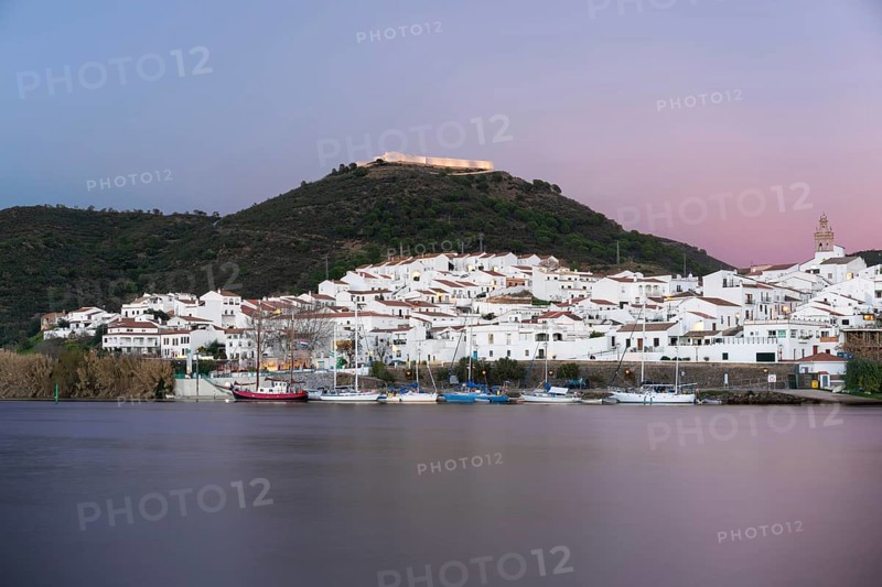 Sanlucar de Guadiana in Spain and Alcoutim in Portugal with sail boats on Guadiana river