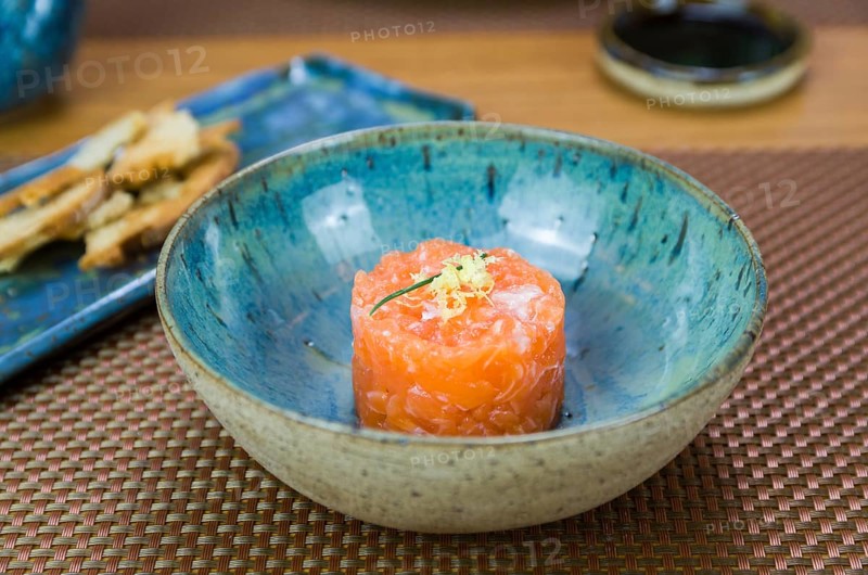 Salmon tartare deliciousness in a beautiful decorated plate