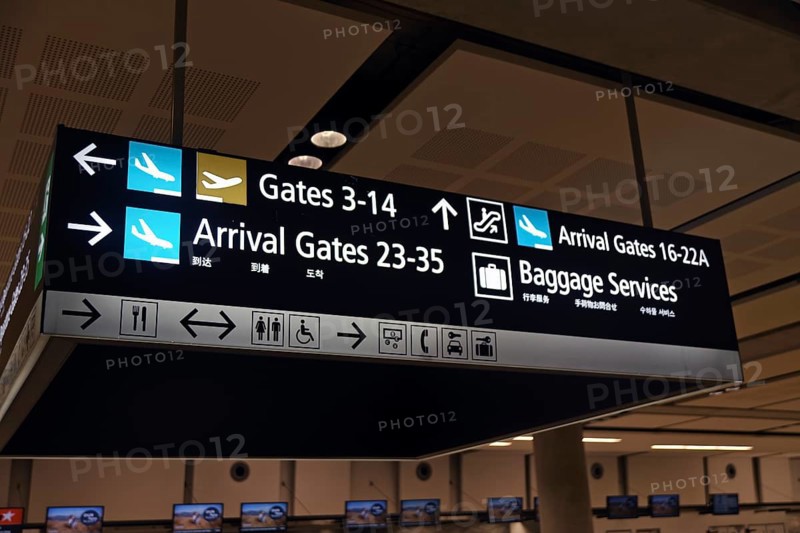 Airport signage directing passengers on international and domestic flights