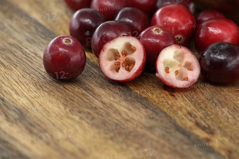 Rustic kitchen scene with fresh cranberries a symbol of health and wellness, often referred to as a superfood