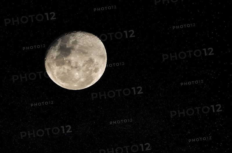 Beautiful photo of the full moon in close up with dark sky in the background