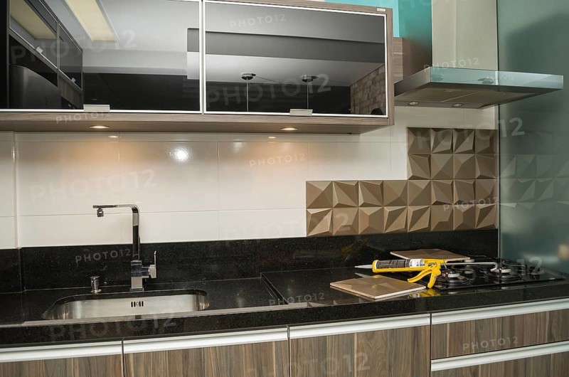 Renovating the kitchen, installing tile on the wall