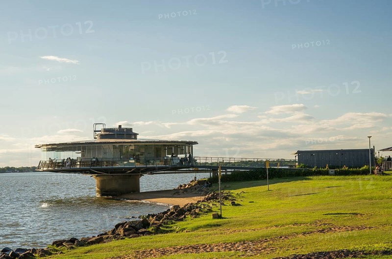 Porto Alegre, Rio Grande do Sul, Brazil, March 29, 2021: Beautiful sunset on the waterfront of Guaíba, Gasometro at golden hour, South America