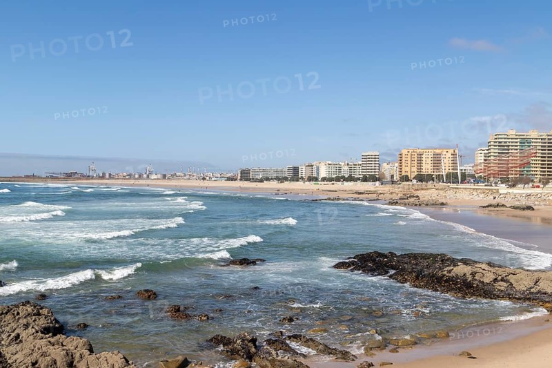 City view with sandy beach and surf in the Atlantic Ocean, She Changes landmark, Rotunda da Anémona, sculpture by artist Janet Echelman on the beach promenade at Praia de Matosinhos beach in Matosinhos, Norte region, Porto district, Portugal, Europe