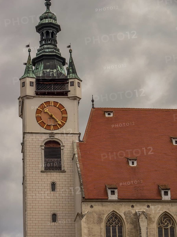 Detailed view of a Gothic clock tower of a church under a gloomy sky, Dürnstein, Wachau, Danube, Austria, Europe