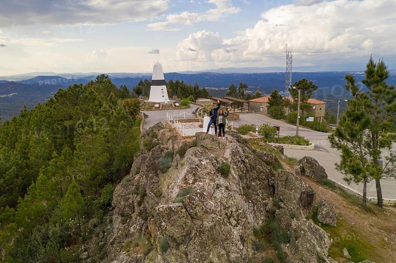 Drone aerial view of a couple in Geographical center Picoto Melrica Centro Geodesico landscape of Portugal in Vila de Rei