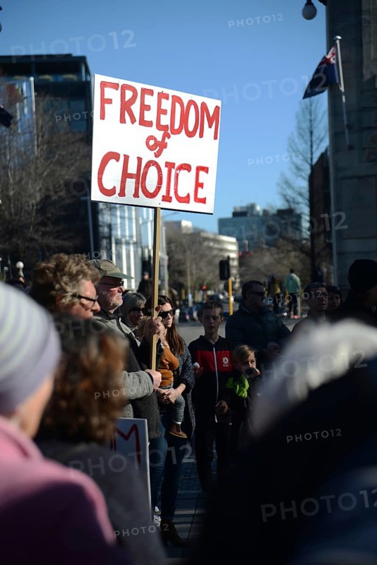 CHRISTCHURCH, NEW ZEALAND, JULY 24, 2021, Detail of a placard at a protest rally at the Bridge of Remembrance in Christchurch. Activists spoke against increasing government control over Covid vaccinations, farm taxes and civil liberties