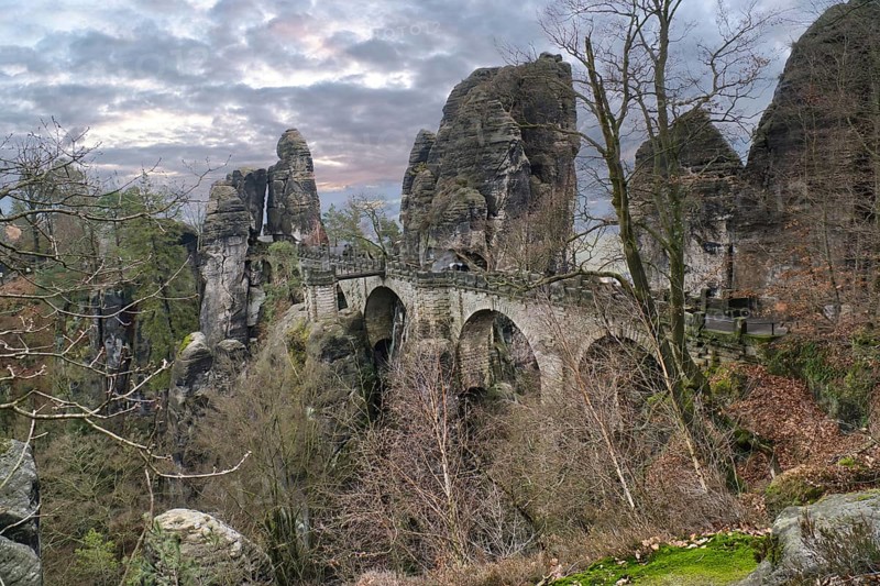 The Bastei Bridge in Saxon Switzerland. jagged rocks, viewing platform overlooking the Elbe. Tourist attraction. Dramatic sky. National park in Germany