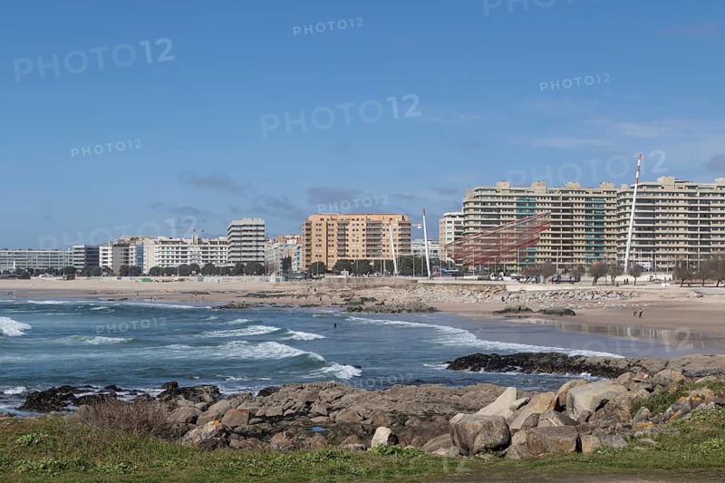 City view with sandy beach and surf in the Atlantic Ocean, She Changes landmark, Rotunda da Anémona, sculpture by artist Janet Echelman on the beach promenade at Praia de Matosinhos beach in Matosinhos, Norte region, Porto district, Portugal, Europe
