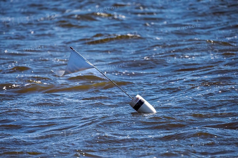 Employees of the Wisconsin Department of Natural Resources, DNR, set fish traps and mark them with buoys