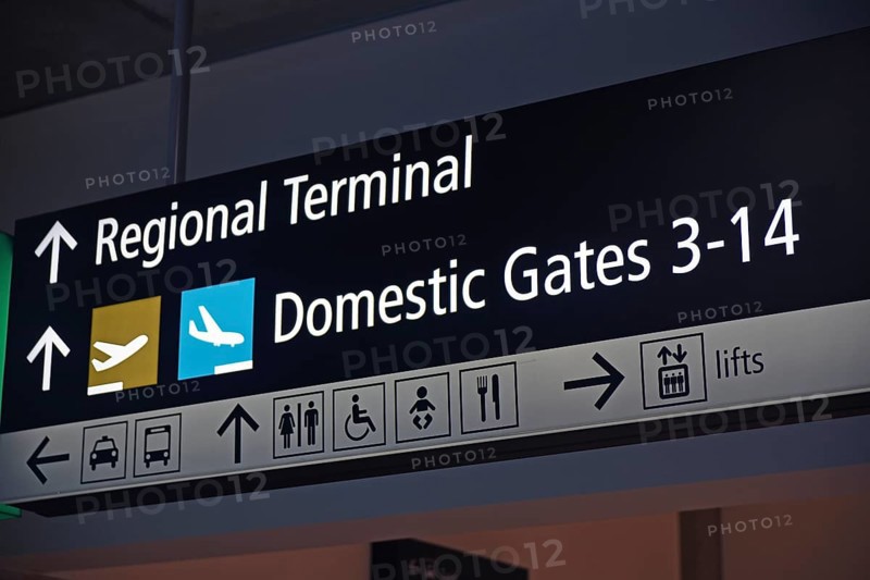 Airport signage directing passengers on regional and domestic flights