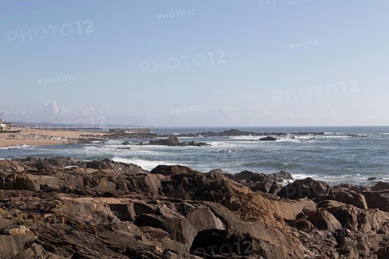 View of rocks and surf in the Atlantic Ocean at Praia do Molhe in Nevogilde, Norte region, Porto district, Portugal, Europe