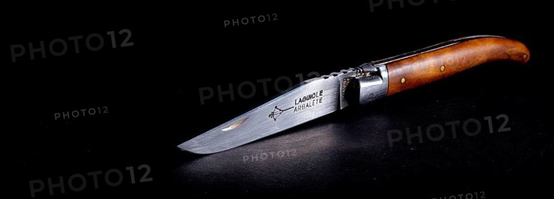 Amsterdam, netherlands. june 2022. Close up of a Laguiole folding knife on a black background. Close up. Selective focus
