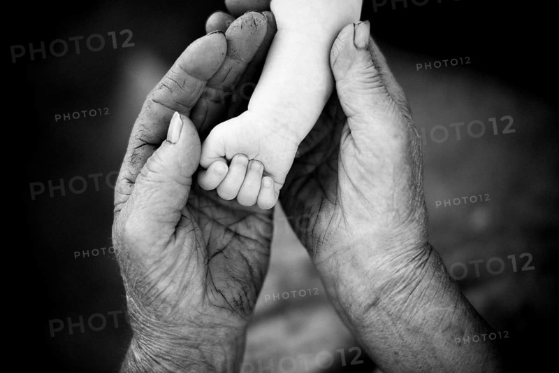 Youth and old age. Hands of grandmother and granddaughter.