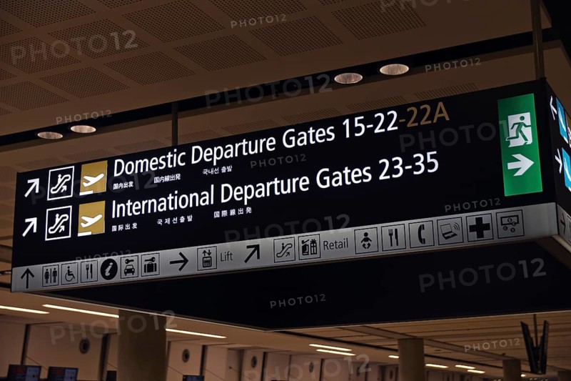 Airport signage directing passengers on international and domestic flights