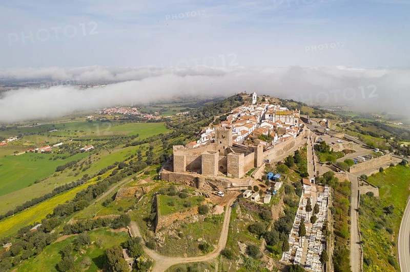Monsaraz drone aerial view on the clouds in Alentejo, Portugal, Europe
