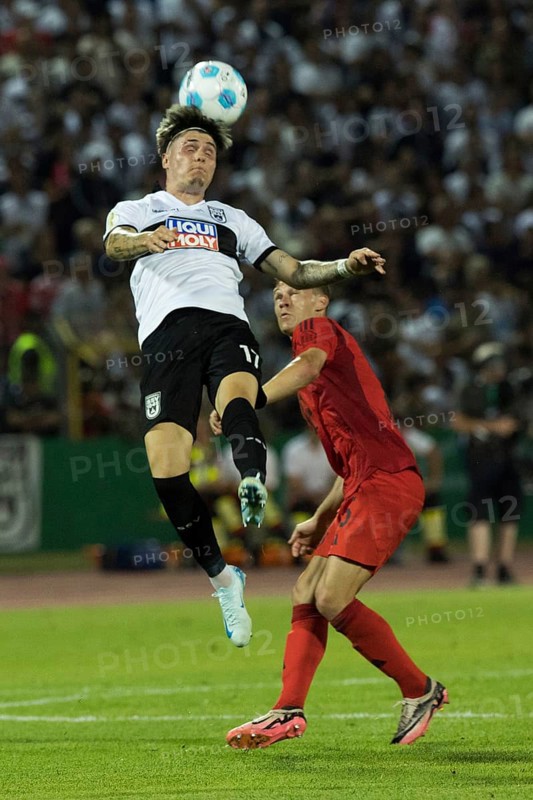 Football match, Niklas KÖLLE SSV Ulm left, heads the ball in the air, Joshua KIMMICH FC Bayern Munich behind him in waiting position, tries to disturb him from behind, Donaustadion football stadium, Ulm, Germany, Europe