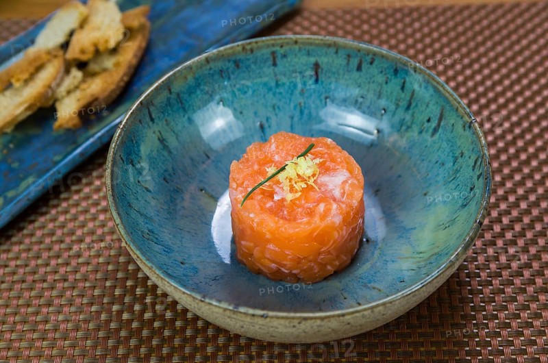 Salmon tartare deliciousness in a beautiful decorated plate