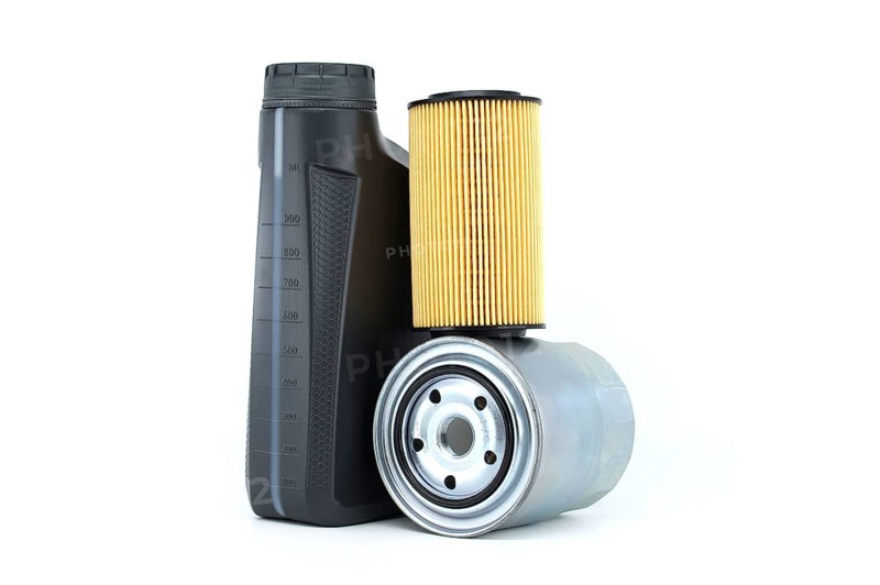Motor oil container and filters isolated on a white background. Car servicing, automotive industry and filter replacing maintenance
