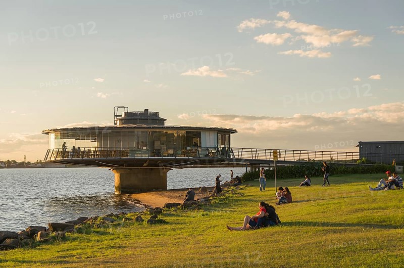 Porto Alegre, Rio Grande do Sul, Brazil, March 29, 2021: Beautiful sunset on the waterfront of Guaíba, Gasometro panorama restaurant at golden hour, South America