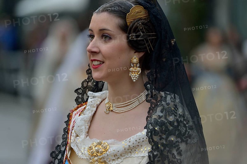 Fallas festival, woman in a traditional costume during the parade in the Plaza de la Virgen de los Desamparados, Valencia, Spain, Europe
