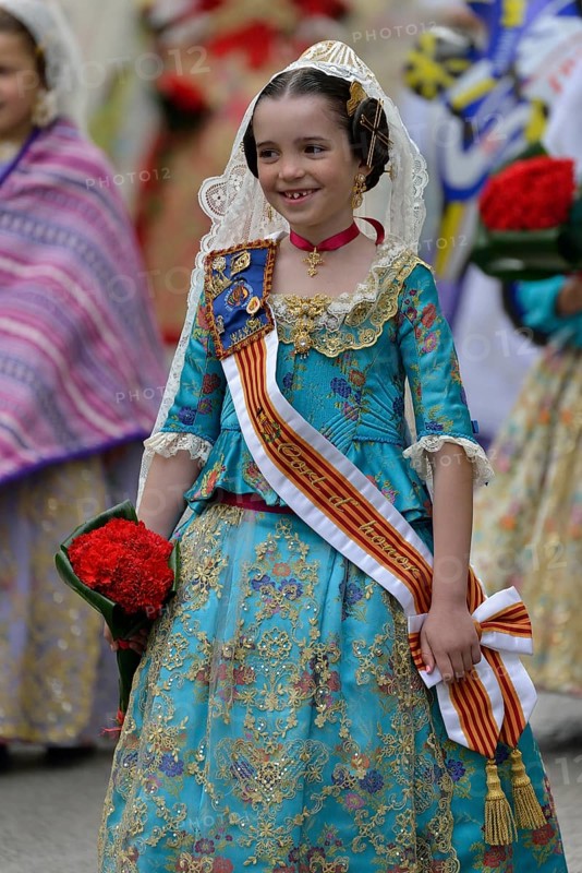 Fallas festival, girl in a traditional costume during the parade in the Plaza de la Virgen de los Desamparados, Valencia, Spain, Europe