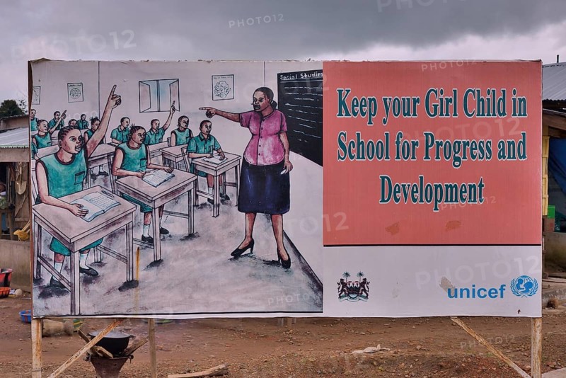 A sign calling on parents to send their children to school, Makeni, Bombali District, Sierra Leone, Africa