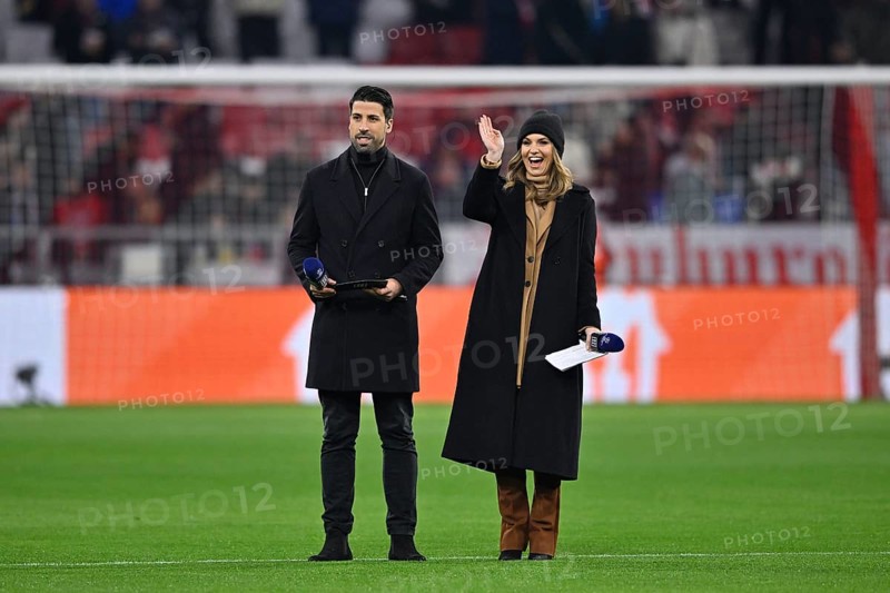 TV pundit Sami Khedira, sports presenter, presenter Laura Wontorra, portrait, cap, with microphone, microphone, DAZN, logo, Champions League, Allianz Arena, Munich, Bavaria, Germany, Europe