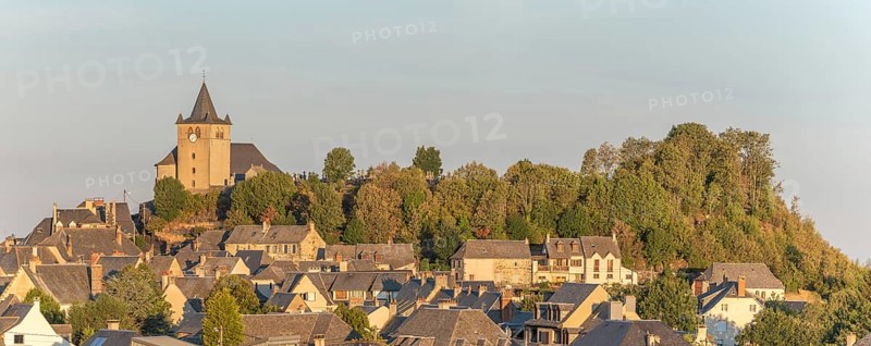 Small Saint-Matthieu church on hill of village of Laguiole. Panorama. Aubrac, France, Europe