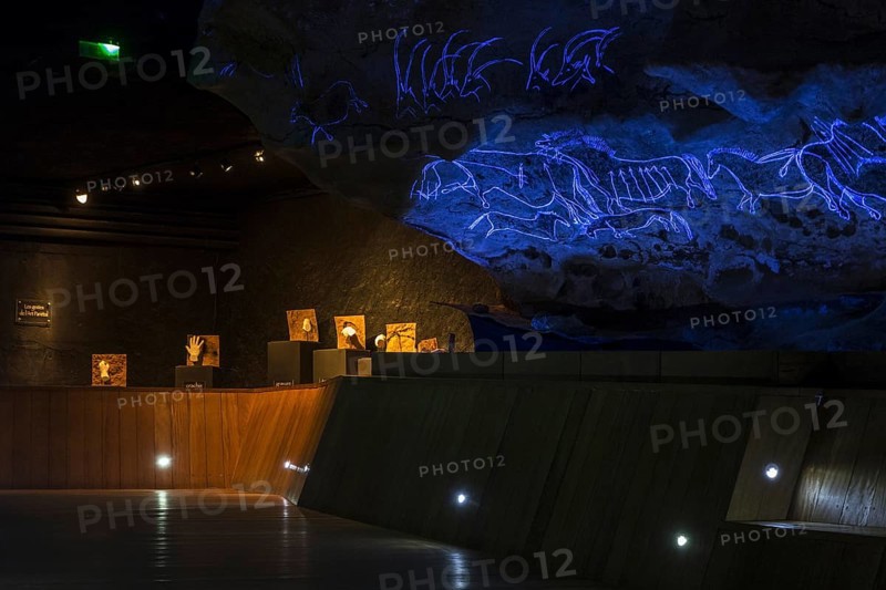 Replica of part of the Lascaux cave showing with black light prehistoric animals incised in the rock at the Le Thot museum, Thonac near Montignac, Dordogne, France, Europe