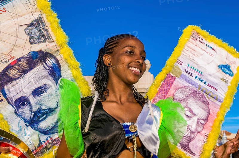 Colourful costumed, pretty women are dancing. Carnival. Mindelo. Cabo Verde. Africa